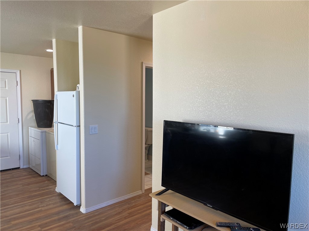 14438 Castle Butte Road Yucca, AZ 86438 - Photo 15 of 33 a room with wooden floor and a bathroom