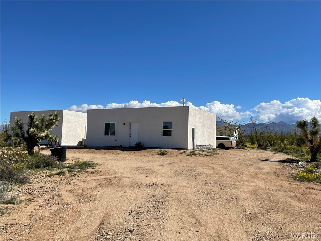 14438 Castle Butte Road Yucca, AZ 86438 - Photo 3 of 33 a view of a house with a yard