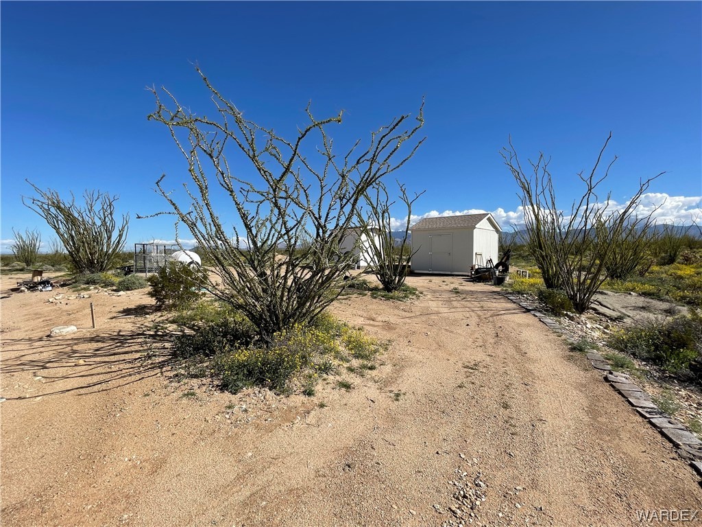 14438 Castle Butte Road Yucca, AZ 86438 - Photo 8 of 33 a view of a backyard of a house