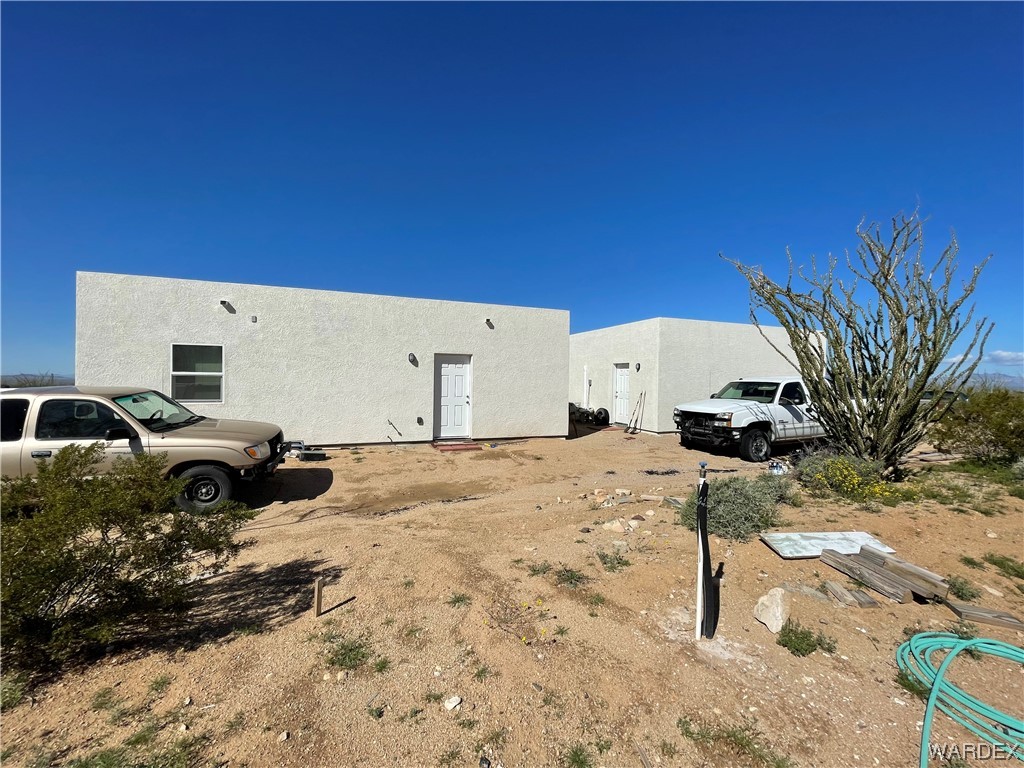 14438 Castle Butte Road Yucca, AZ 86438 - Photo 10 of 33 a view of a backyard of a house