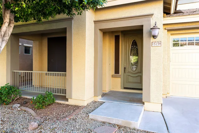 a view of a house with a small yard