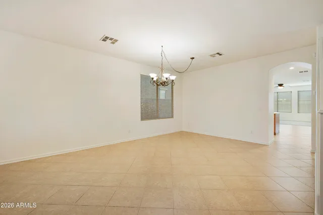 a view of a livingroom with a chandelier fan