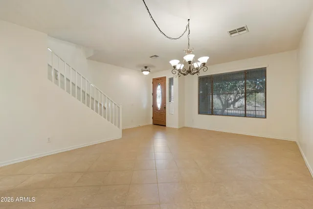 a view of a chandelier in big room and chandelier