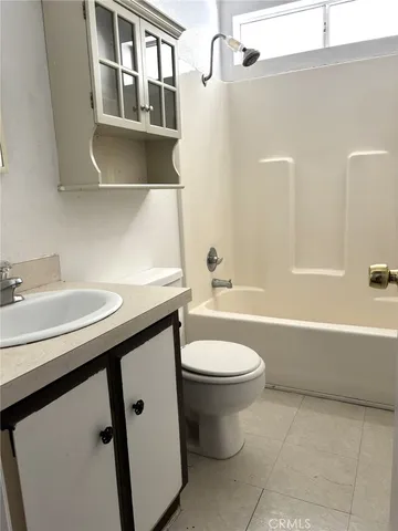 a bathroom with a sink a toilet and a bathtub