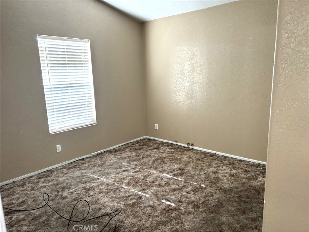 20843 Waalew Road, Unit C4 Apple Valley, CA 92307 - Photo 18 of 38 a view of empty room with window