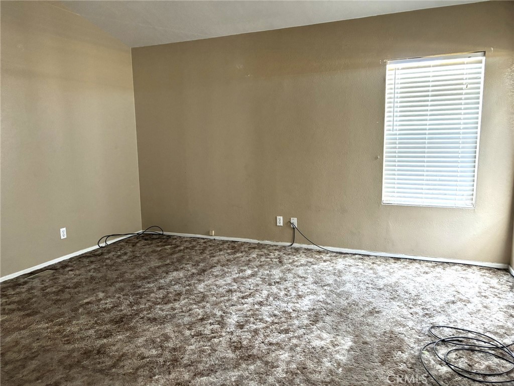 20843 Waalew Road, Unit C4 Apple Valley, CA 92307 - Photo 20 of 38 a view of an empty room and window