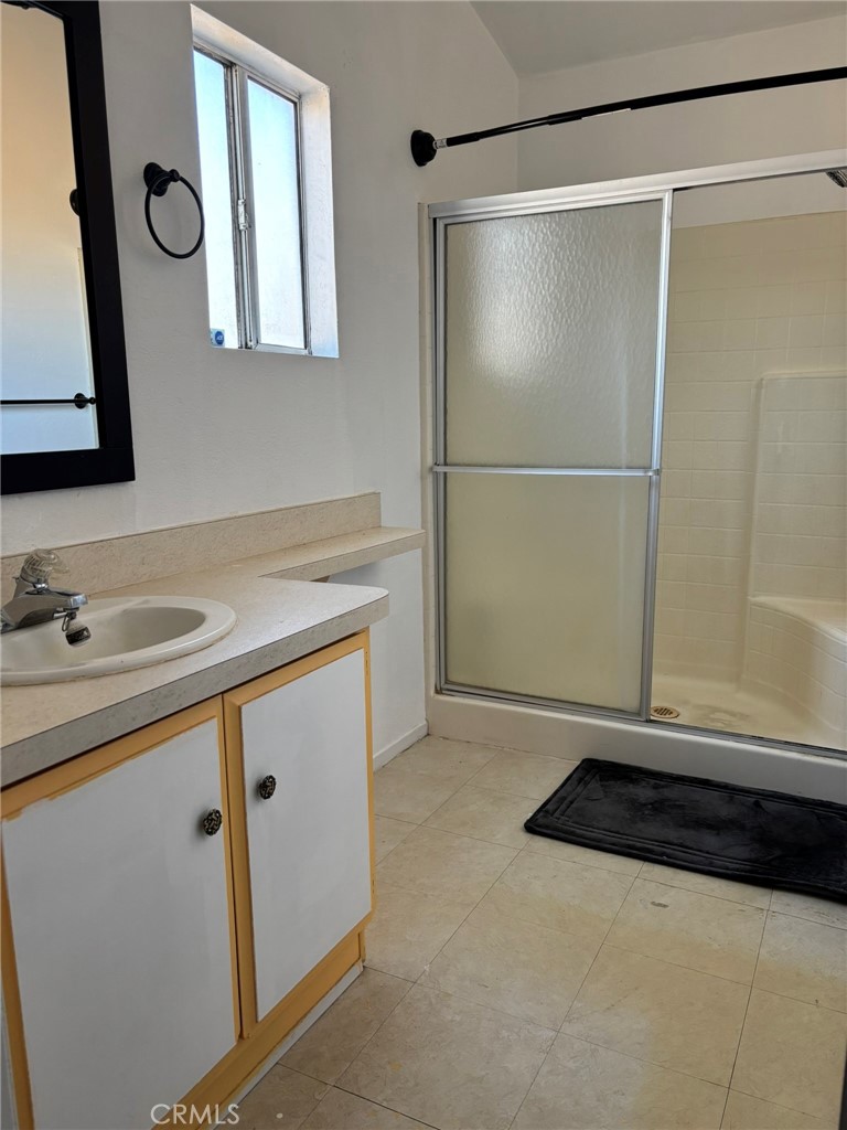 20843 Waalew Road, Unit C4 Apple Valley, CA 92307 - Photo 22 of 38 a bathroom with a sink and a mirror