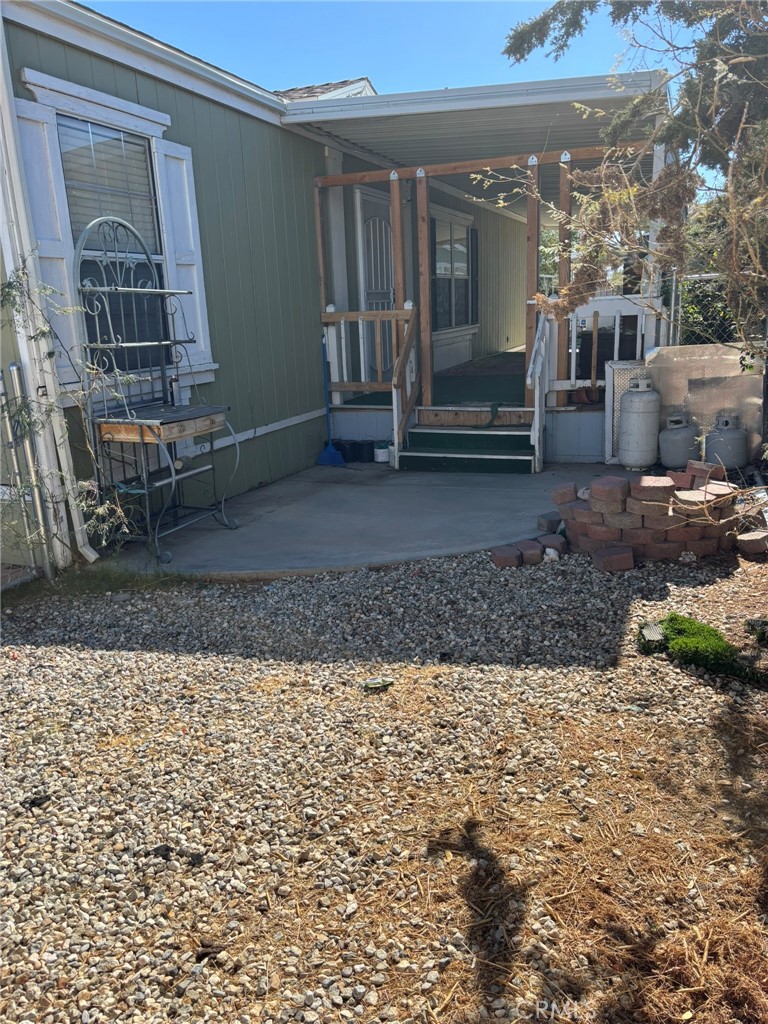 20843 Waalew Road, Unit C4 Apple Valley, CA 92307 - Photo 24 of 38 a view of a house with a yard
