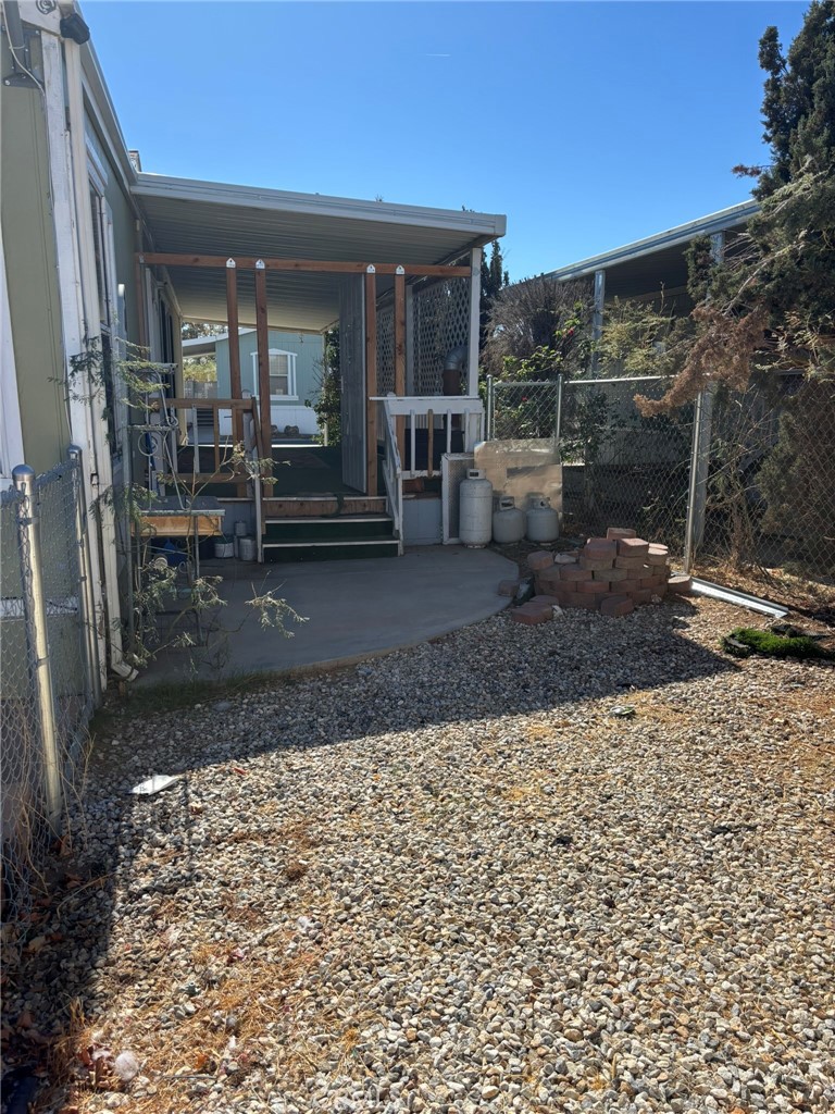 20843 Waalew Road, Unit C4 Apple Valley, CA 92307 - Photo 25 of 38 a view of a porch with a table and chairs