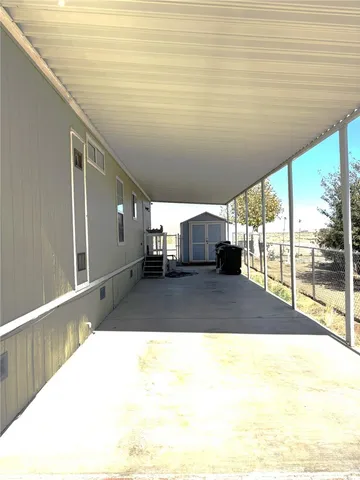 a swimming pool with outdoor seating and plants