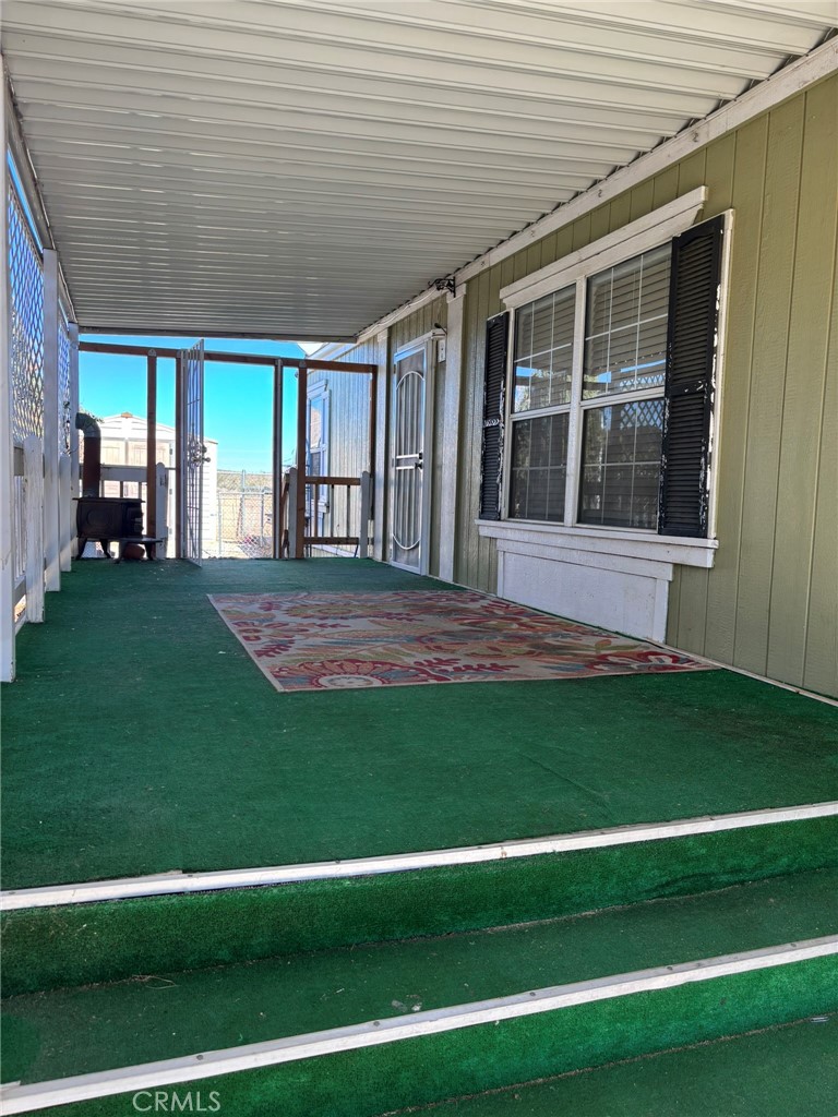 20843 Waalew Road, Unit C4 Apple Valley, CA 92307 - Photo 4 of 38 a view of a backyard with plants and large trees