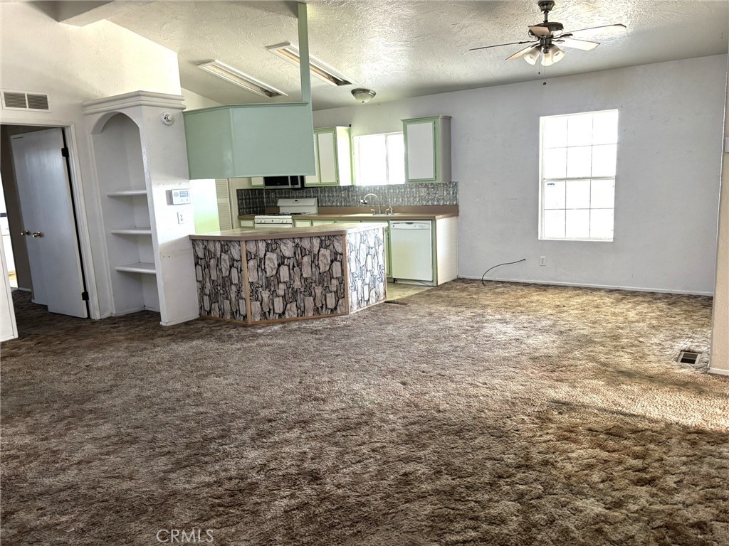 20843 Waalew Road, Unit C4 Apple Valley, CA 92307 - Photo 7 of 38 a view of a kitchen with a sink and cabinets