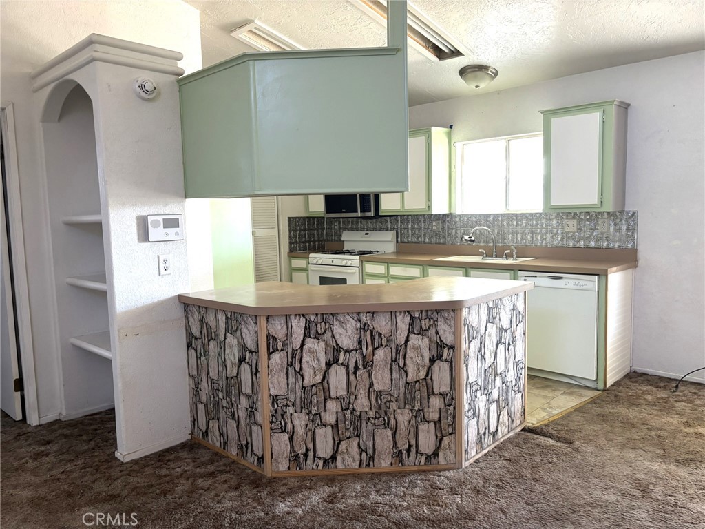 20843 Waalew Road, Unit C4 Apple Valley, CA 92307 - Photo 8 of 38 a bathroom with a sink a mirror and a bathtub