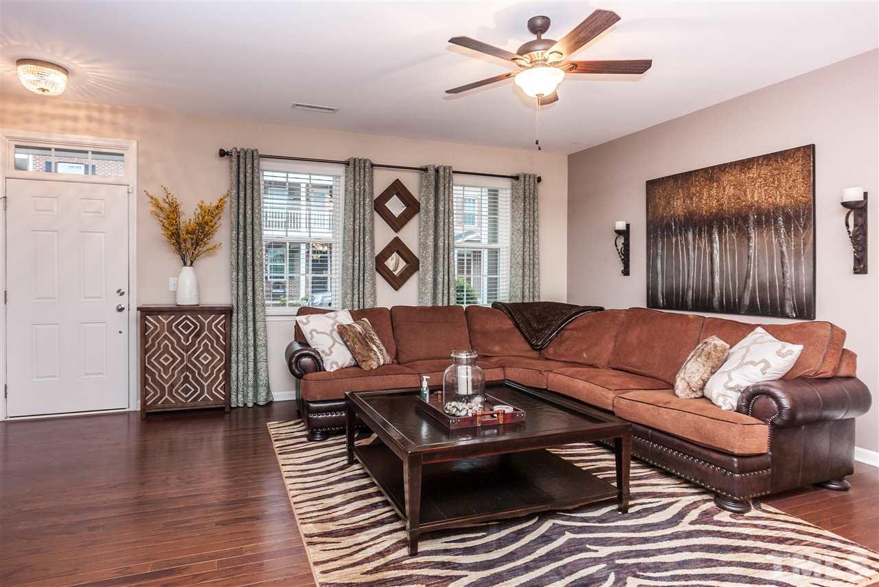 1306 Still Monument Way Raleigh, NC 27603 - Photo 2 of 25 a living room with furniture and a window