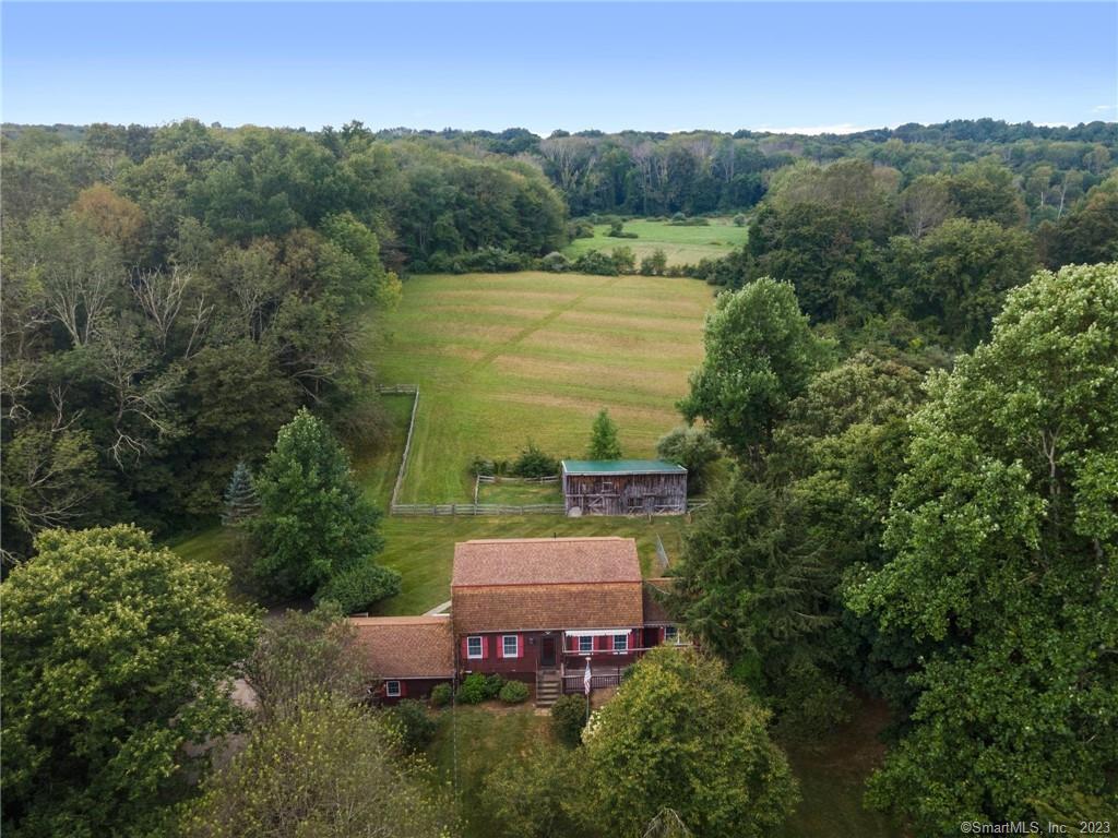 121 South Bigelow Road Hampton, CT 06247 - Photo 1 of 1 an aerial view of a house with a garden and a yard