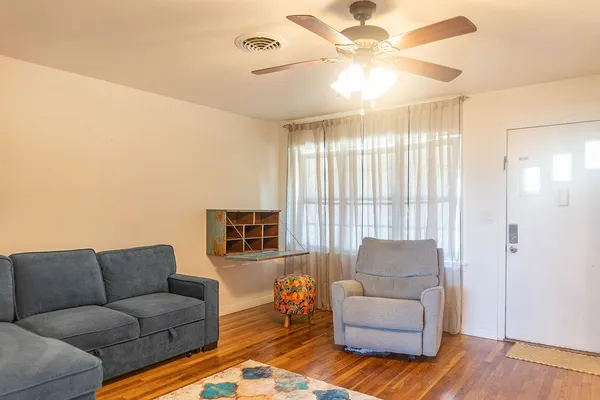 a living room with furniture and a large window
