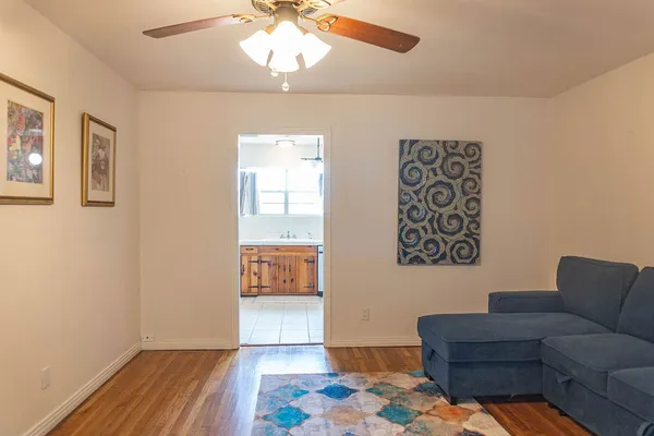 a living room with furniture and a rug