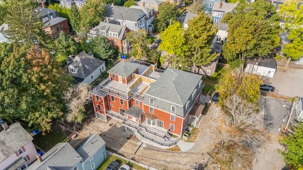 an aerial view of residential house with parking space