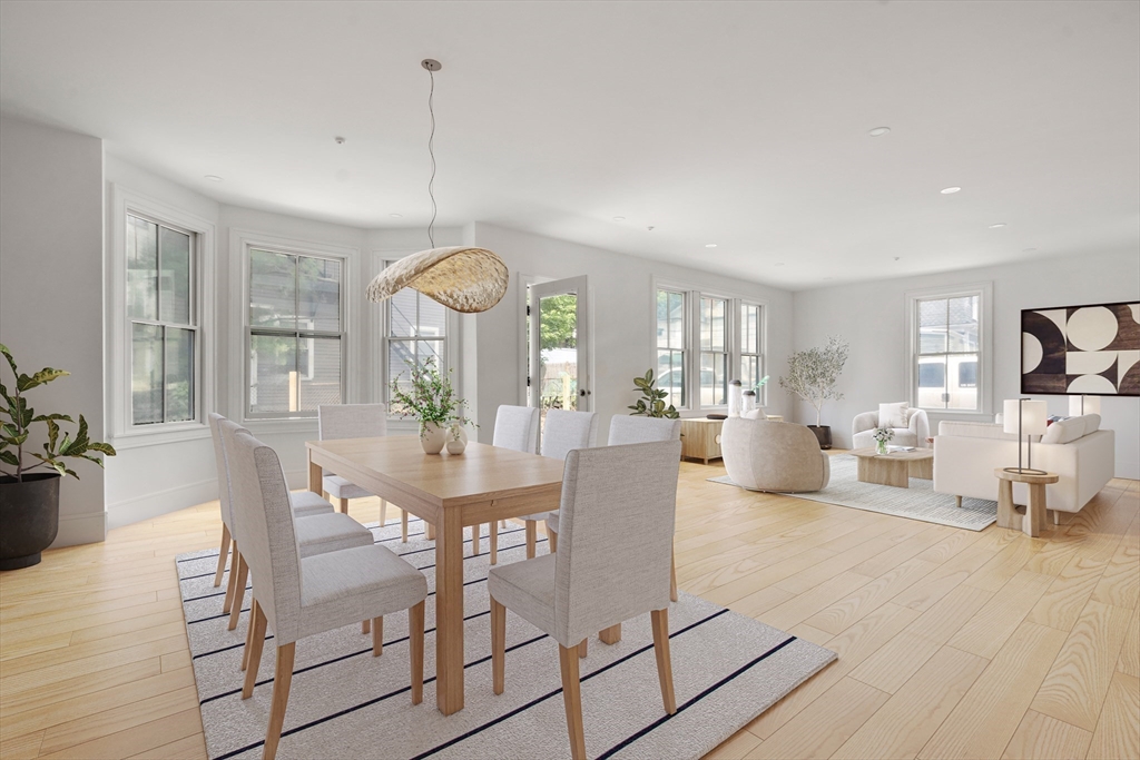 11 Goodwin Place, Unit 1 Brookline, MA 02445 - Photo 6 of 8 a view of a dining room with furniture window and wooden floor
