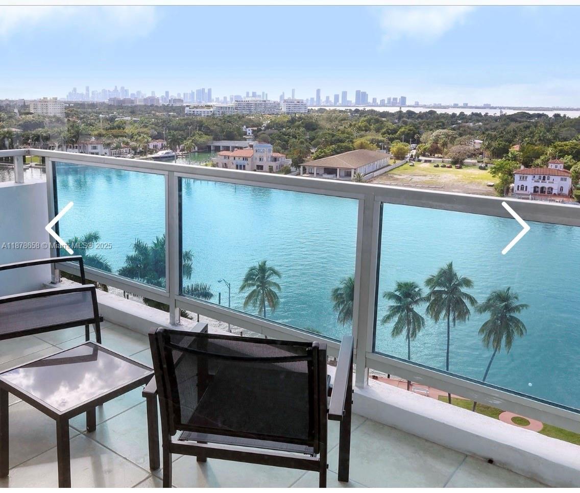 5101 Collins Avenue, Unit 14A Miami Beach, FL 33140 - Photo 11 of 14 a terrace with outdoor seating and city view