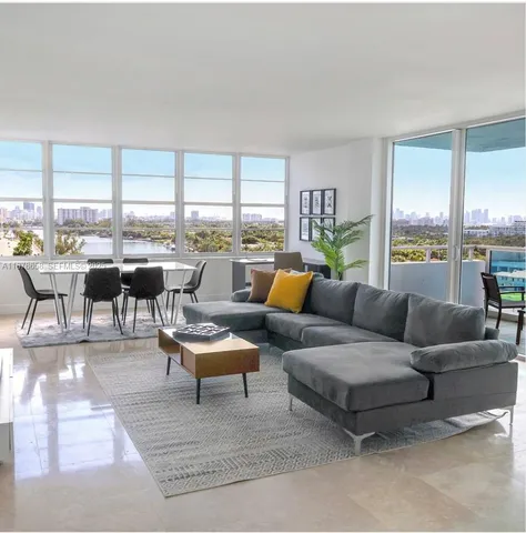 a view of swimming pool with a table and chairs