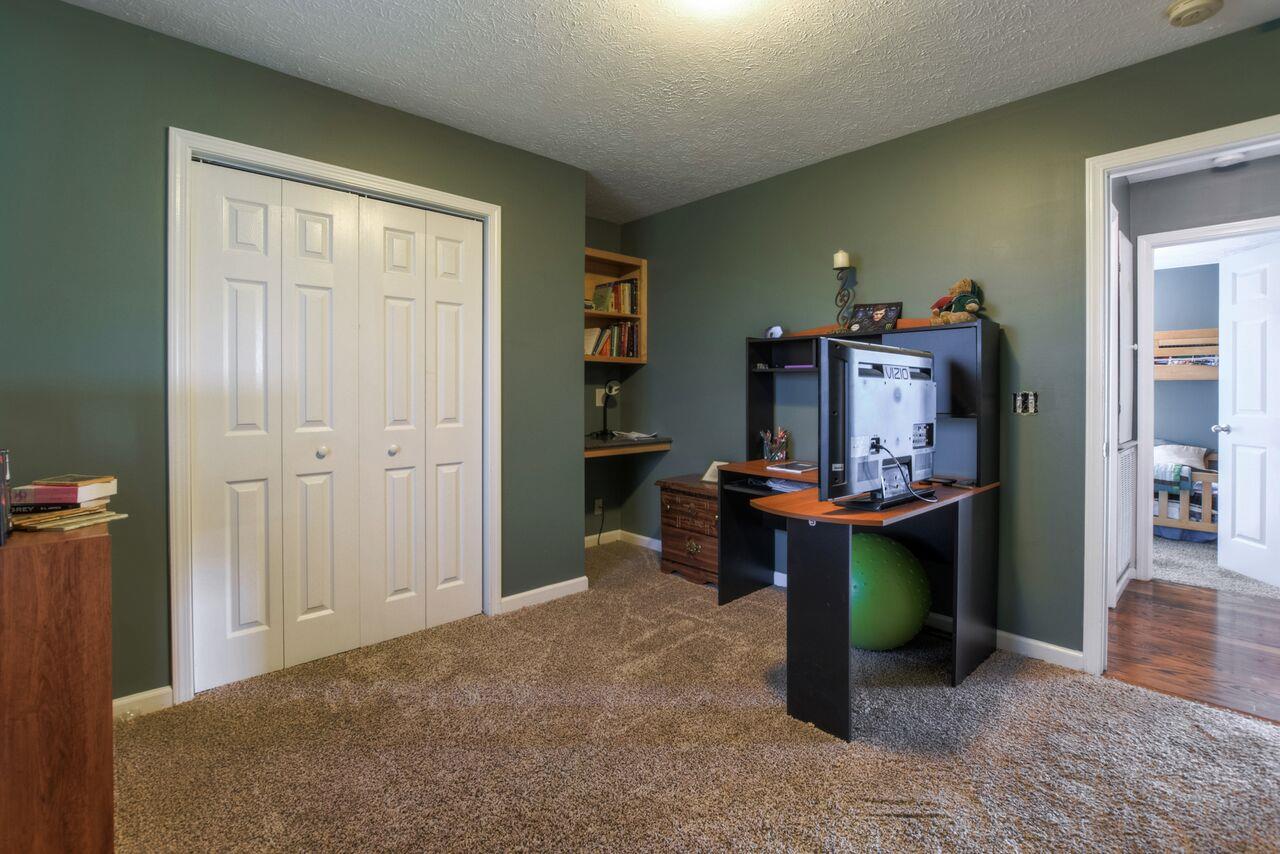 722 Lear Road Portland, TN 37148 - Photo 11 of 20 a workspace with furniture and closet