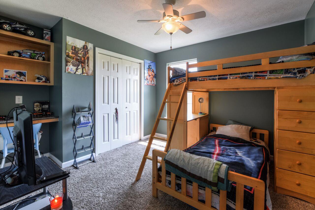 722 Lear Road Portland, TN 37148 - Photo 12 of 20 a bedroom with bunk bed and a window