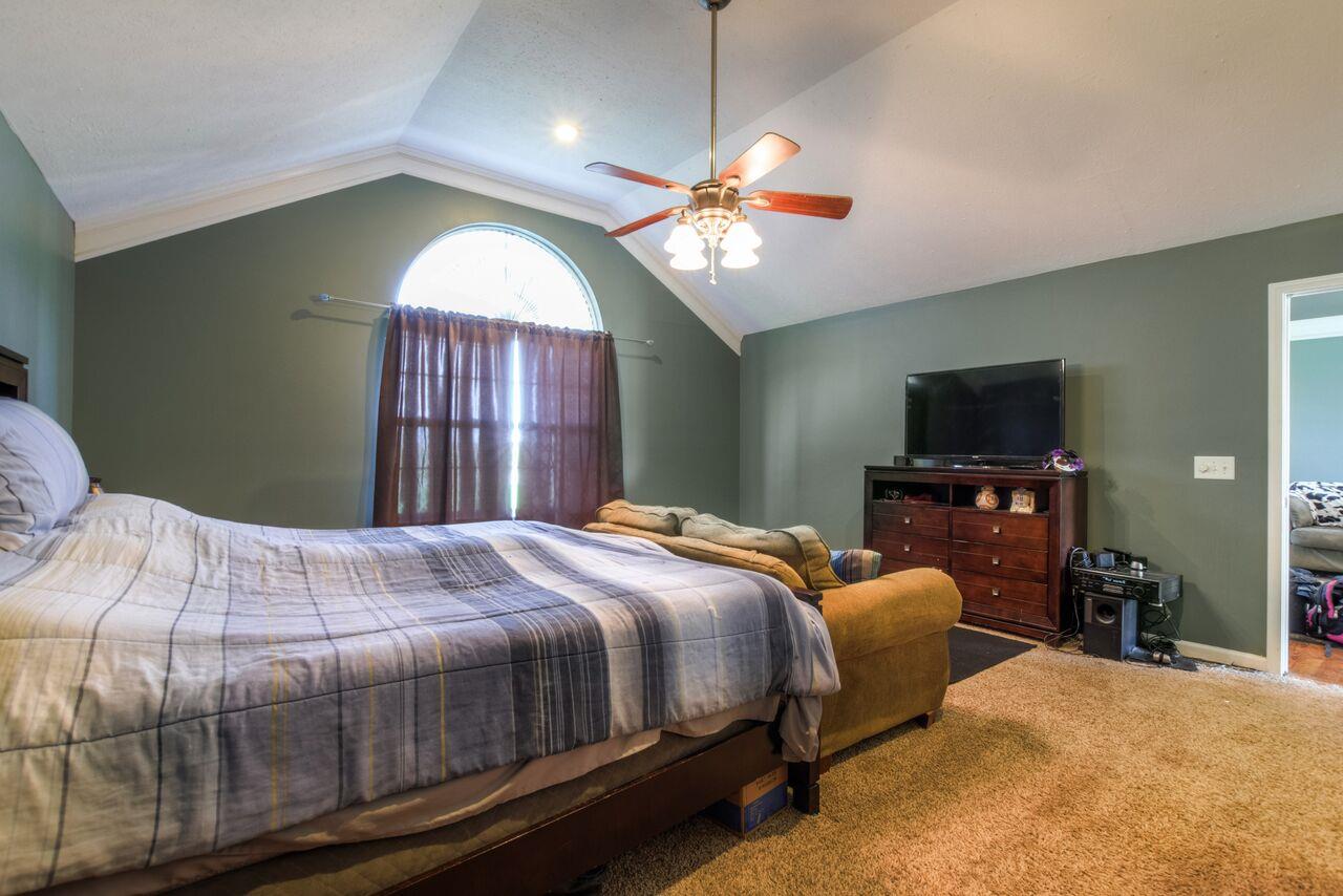 722 Lear Road Portland, TN 37148 - Photo 14 of 20 a bedroom with a bed and a mirror