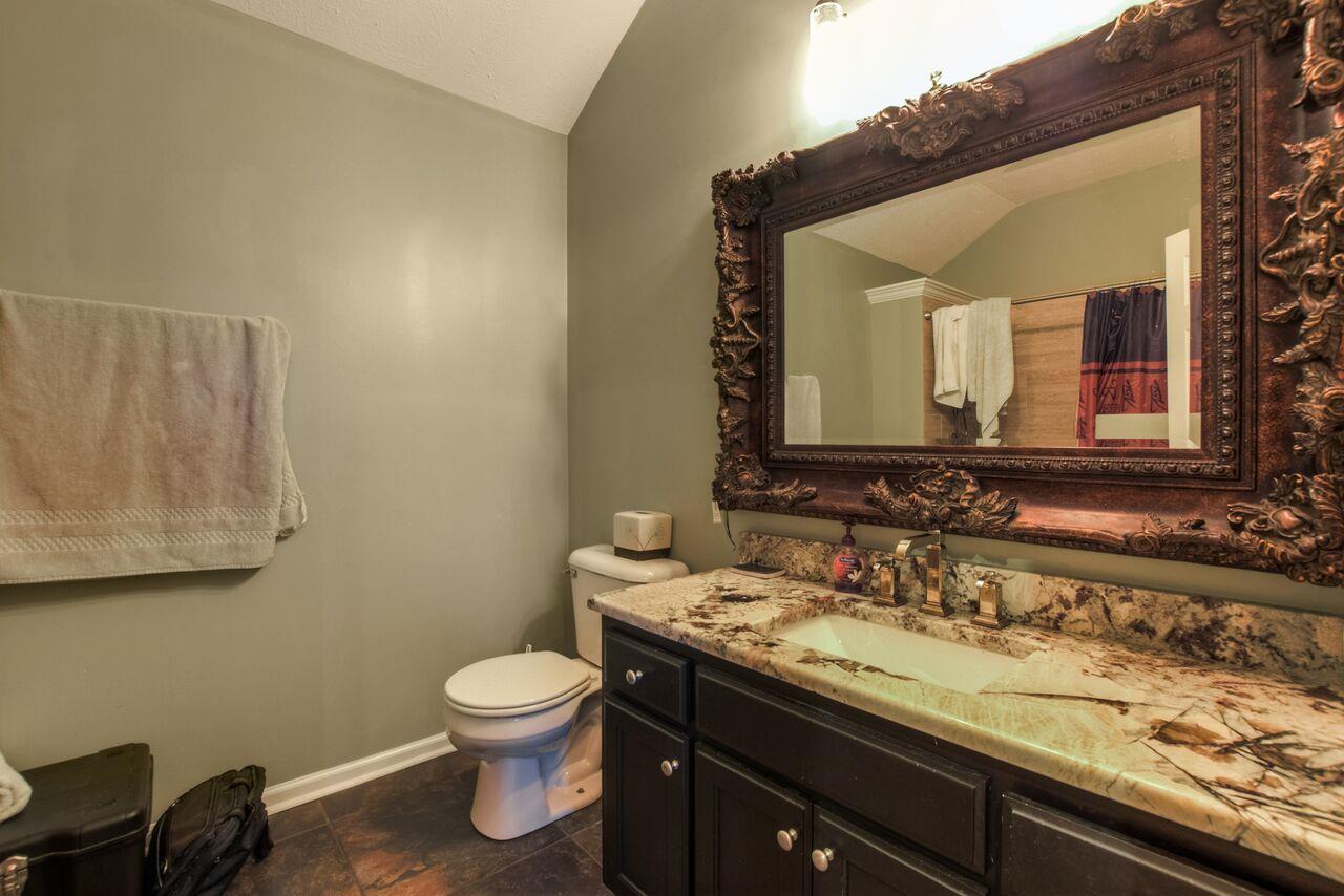 722 Lear Road Portland, TN 37148 - Photo 15 of 20 a bathroom with a granite countertop sink and a mirror