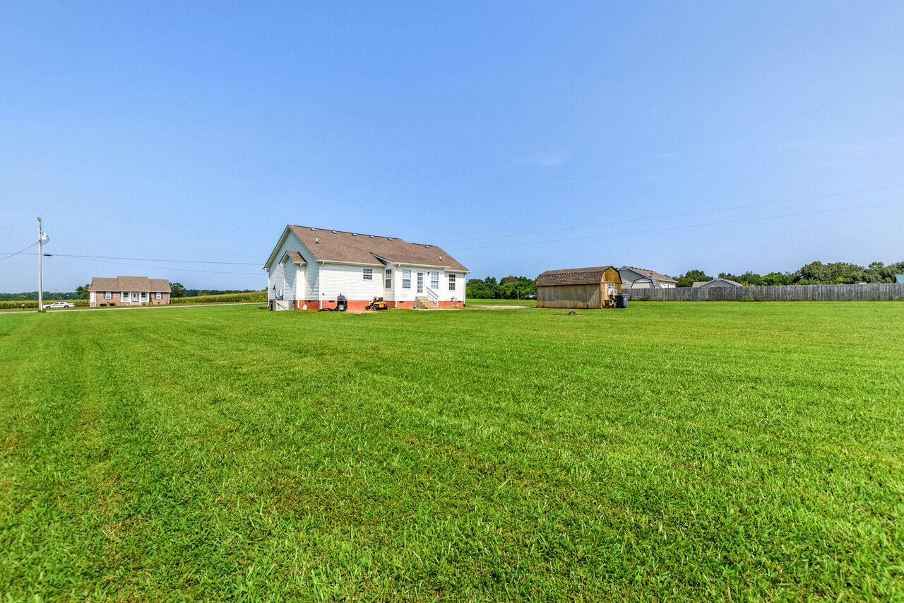 722 Lear Road Portland, TN 37148 - Photo 20 of 20 a backyard of a house with lots of green space and fog