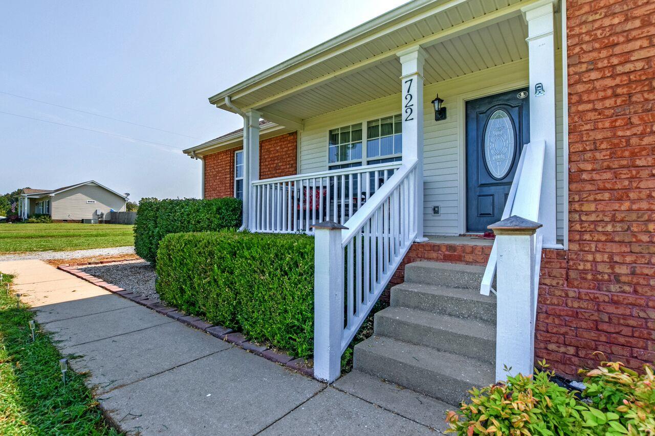 722 Lear Road Portland, TN 37148 - Photo 3 of 20 a view of a house with wooden walls and a porch
