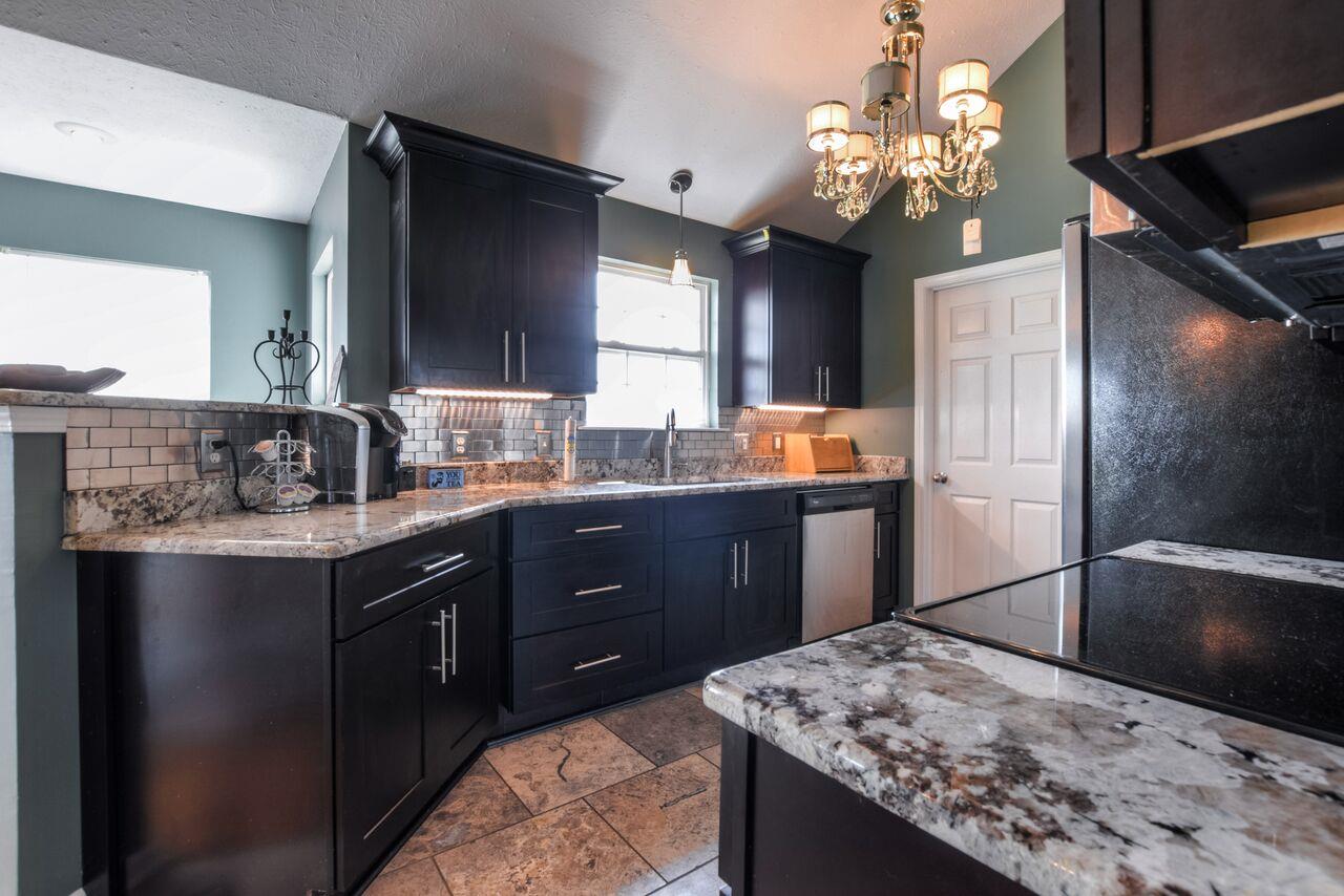 722 Lear Road Portland, TN 37148 - Photo 9 of 20 a kitchen with stainless steel appliances granite countertop counter space a sink stove and refrigerator