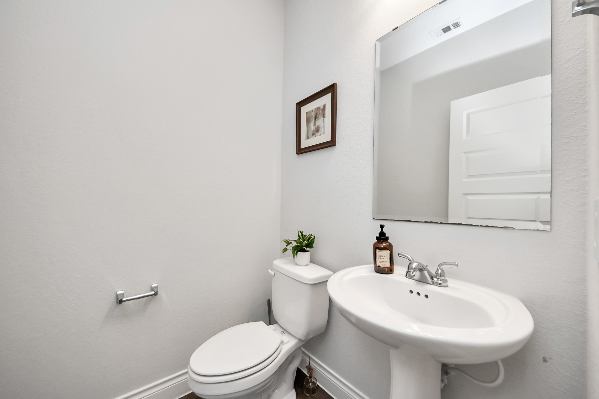 2242 Bayleaf Manor Drive Manvel, TX 77578 - Photo 13 of 50 a bathroom with a sink mirror and toilet