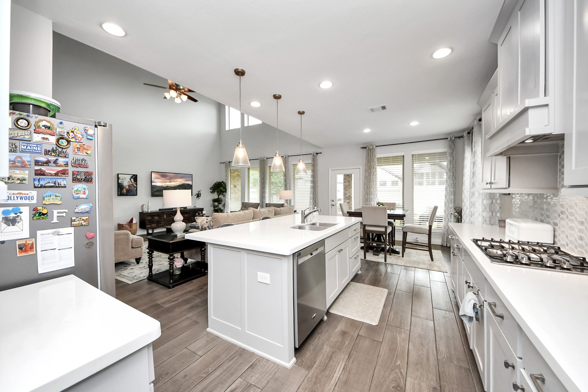 2242 Bayleaf Manor Drive Manvel, TX 77578 - Photo 20 of 48 a kitchen with a sink a counter top space and stainless steel appliances