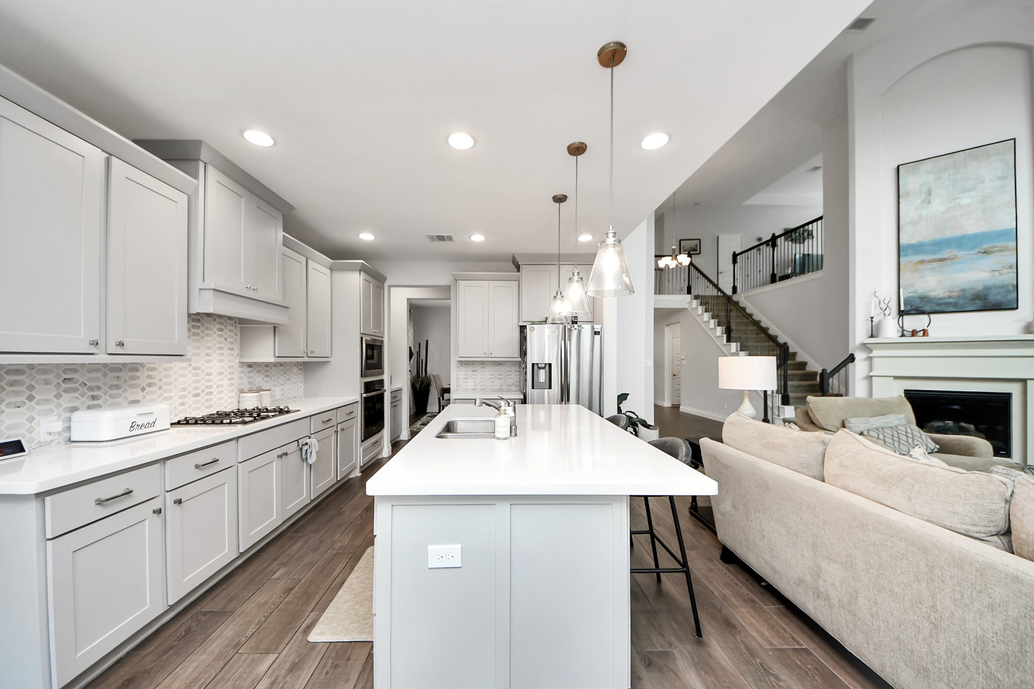 2242 Bayleaf Manor Drive Manvel, TX 77578 - Photo 21 of 48 a kitchen with a stove a sink and a refrigerator