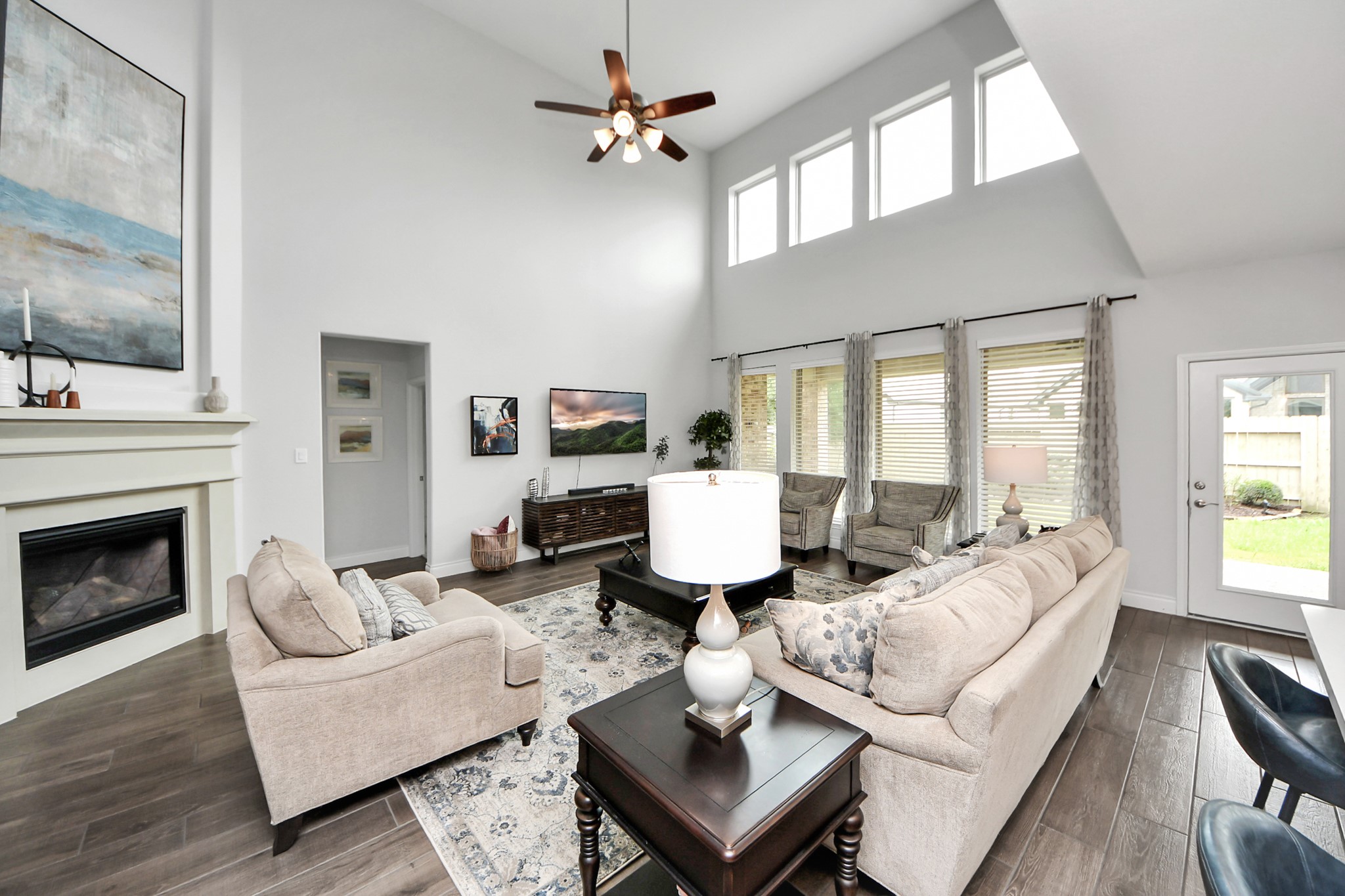 2242 Bayleaf Manor Drive Manvel, TX 77578 - Photo 22 of 50 a living room with furniture fireplace and a large window