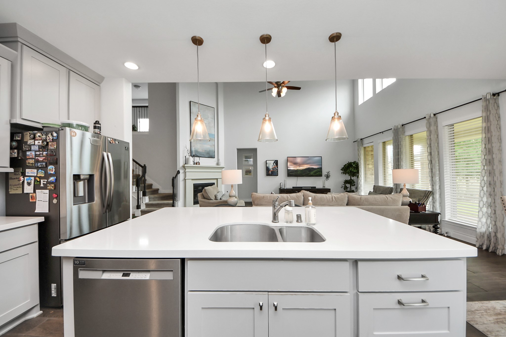 2242 Bayleaf Manor Drive Manvel, TX 77578 - Photo 23 of 48 a kitchen with stainless steel appliances a sink a stove a refrigerator and cabinets