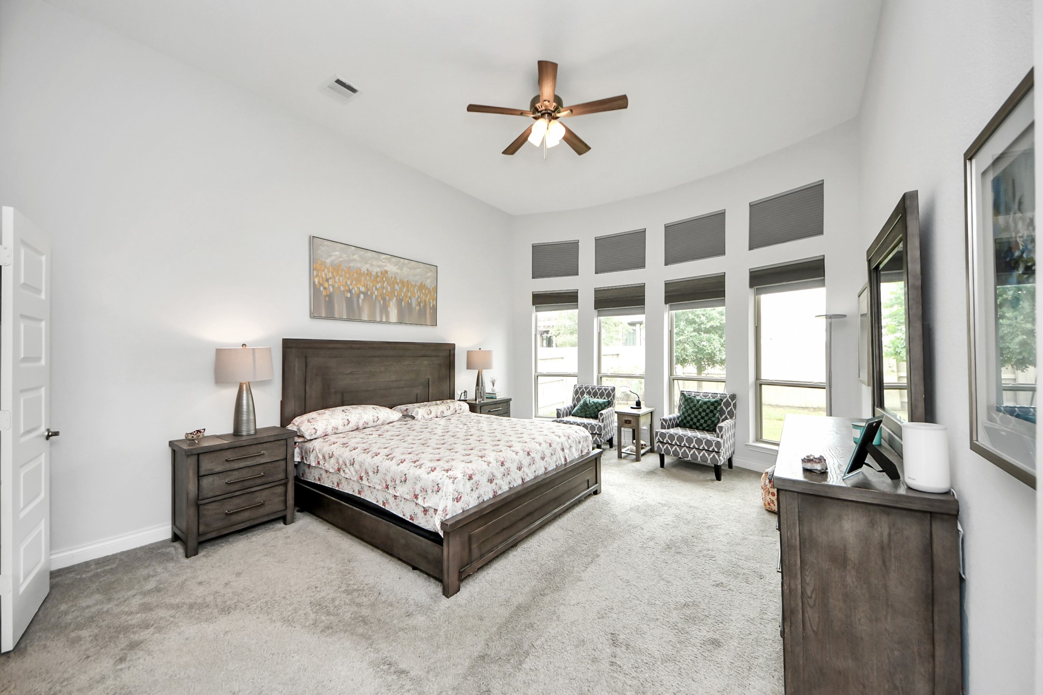2242 Bayleaf Manor Drive Manvel, TX 77578 - Photo 27 of 50 a living room with a bed furniture large window and flat screen tv