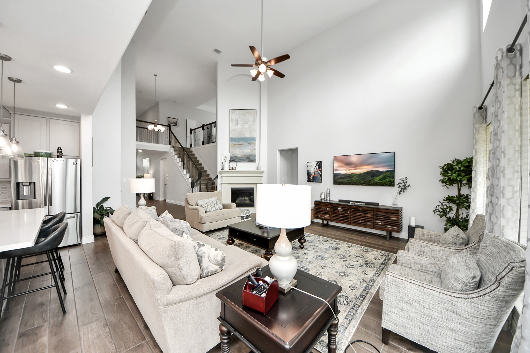 2242 Bayleaf Manor Drive Manvel, TX 77578 - Photo 27 of 48 a living room with furniture and a flat screen tv