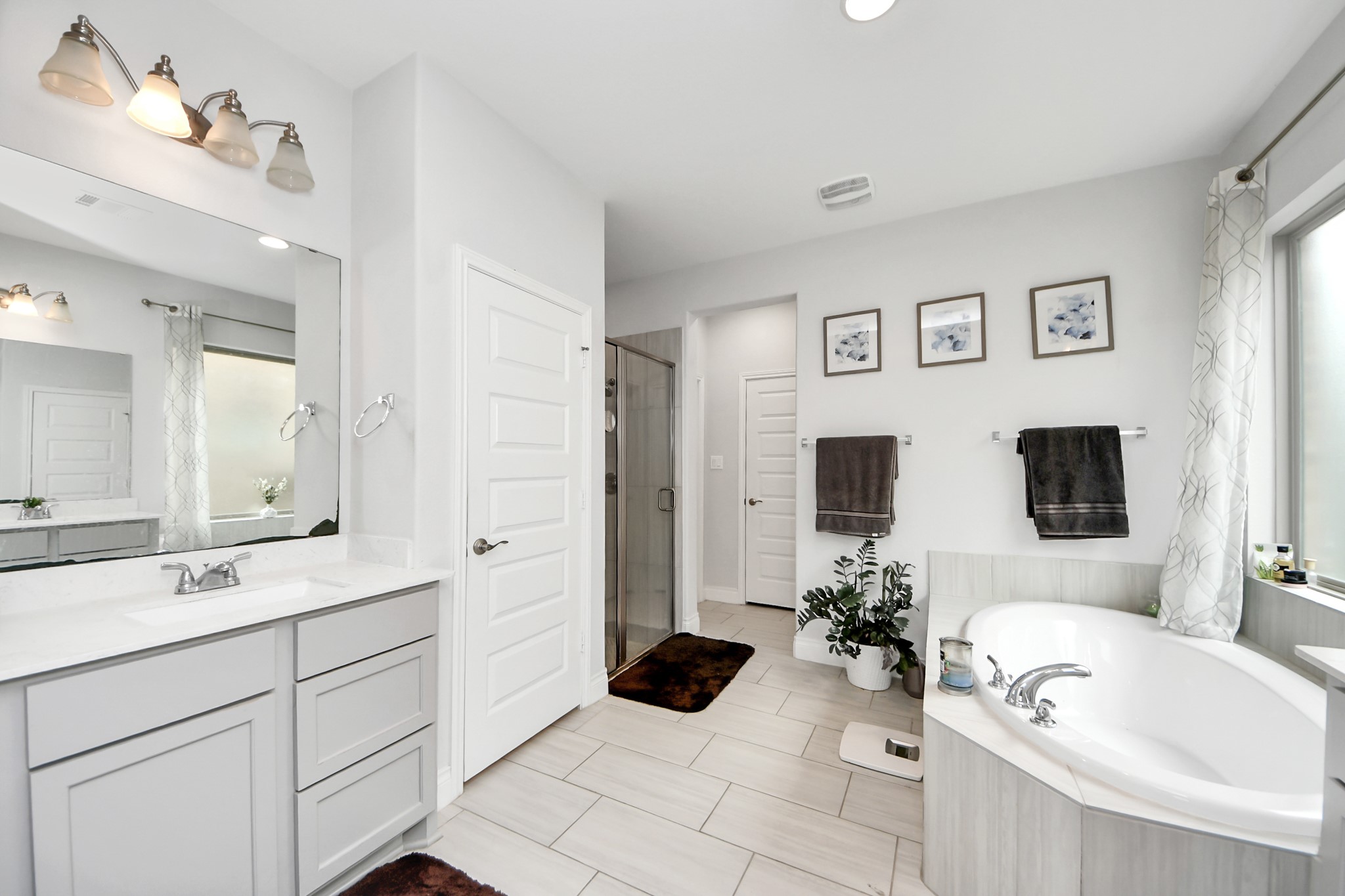 2242 Bayleaf Manor Drive Manvel, TX 77578 - Photo 28 of 50 a spacious en suite bathroom with a double vanity sink a mirror a and a shower
