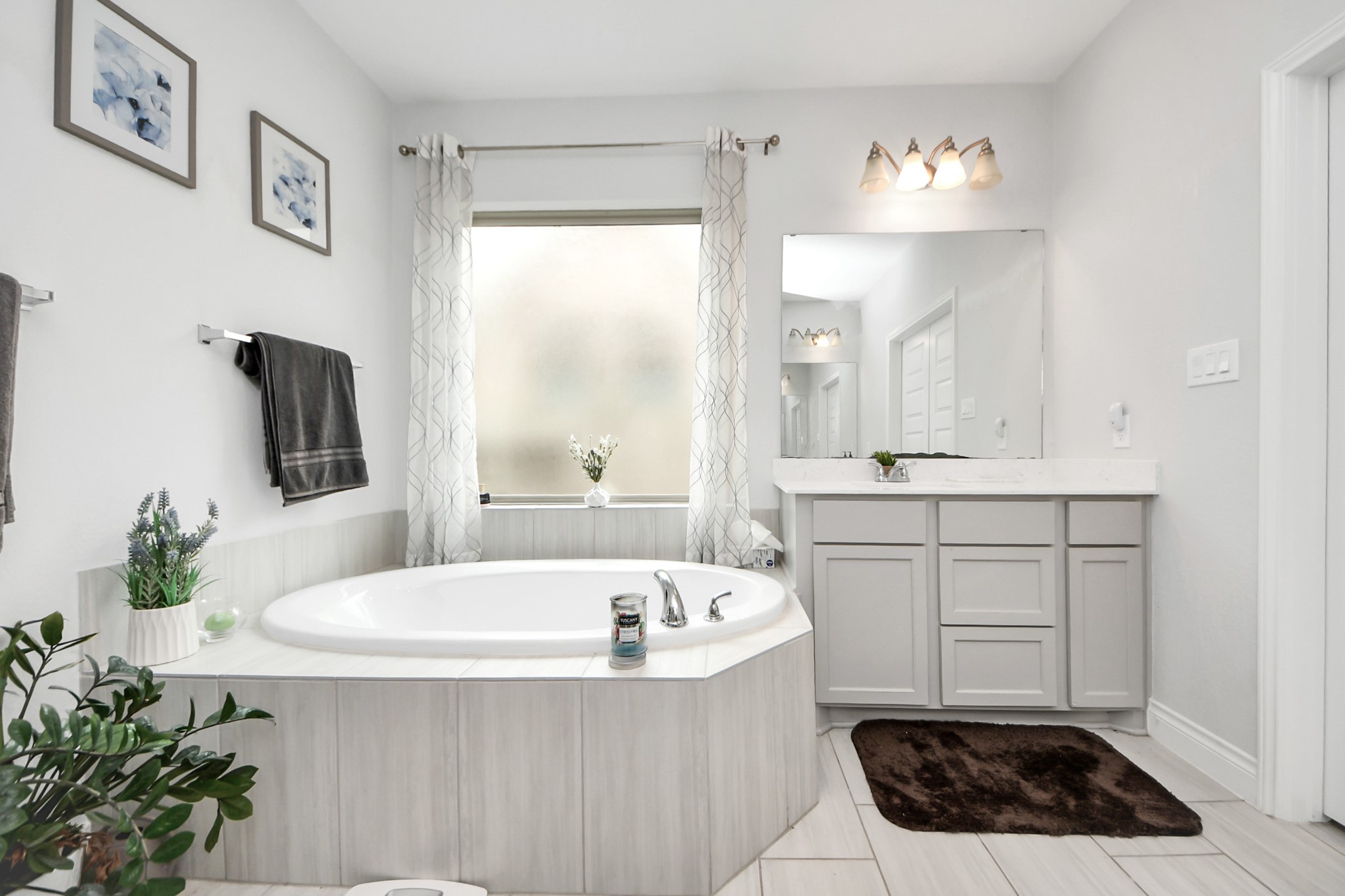 2242 Bayleaf Manor Drive Manvel, TX 77578 - Photo 31 of 50 a bathroom with a tub sink and mirror