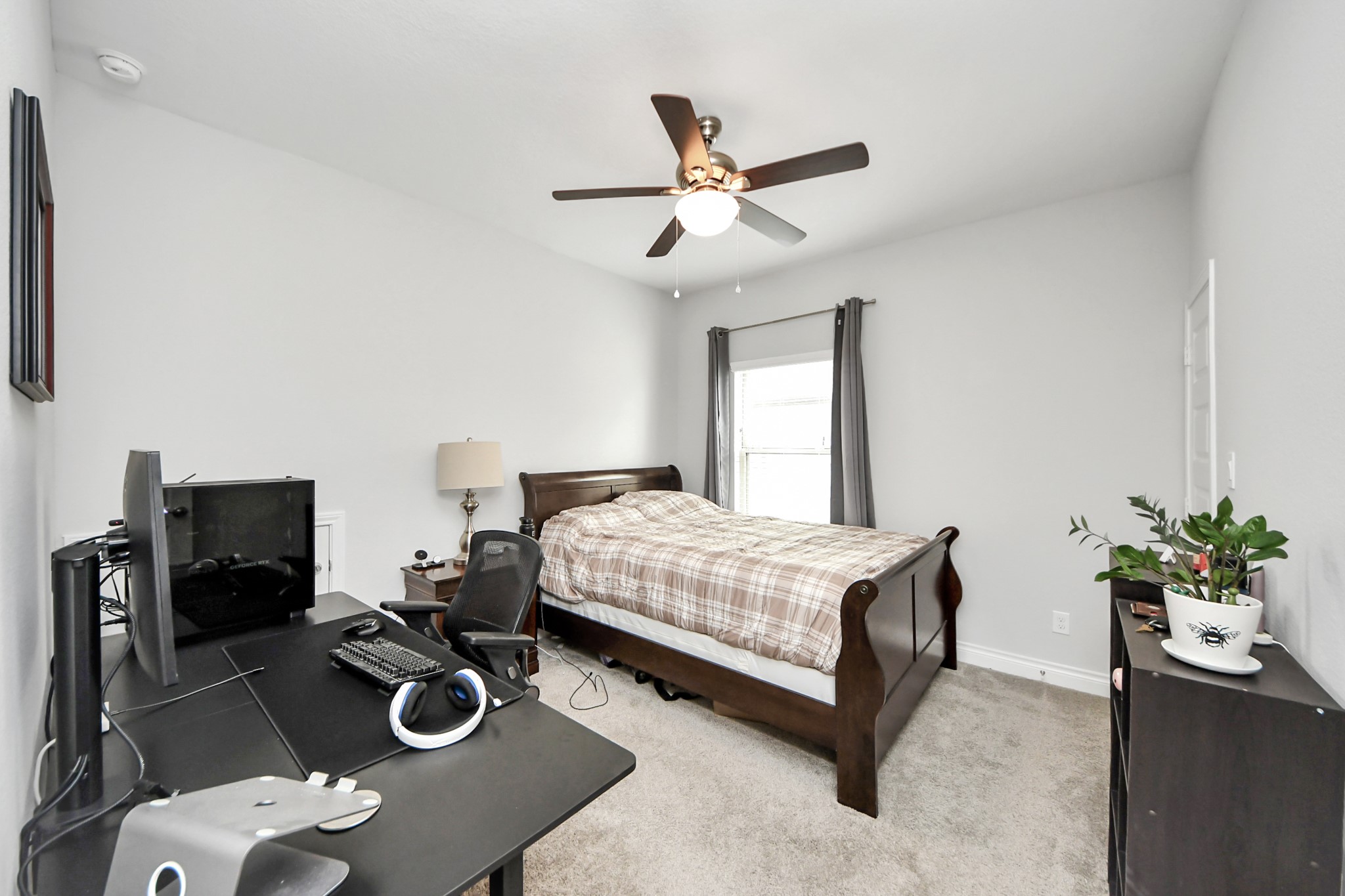 2242 Bayleaf Manor Drive Manvel, TX 77578 - Photo 39 of 50 a bedroom with a bed and a chandelier