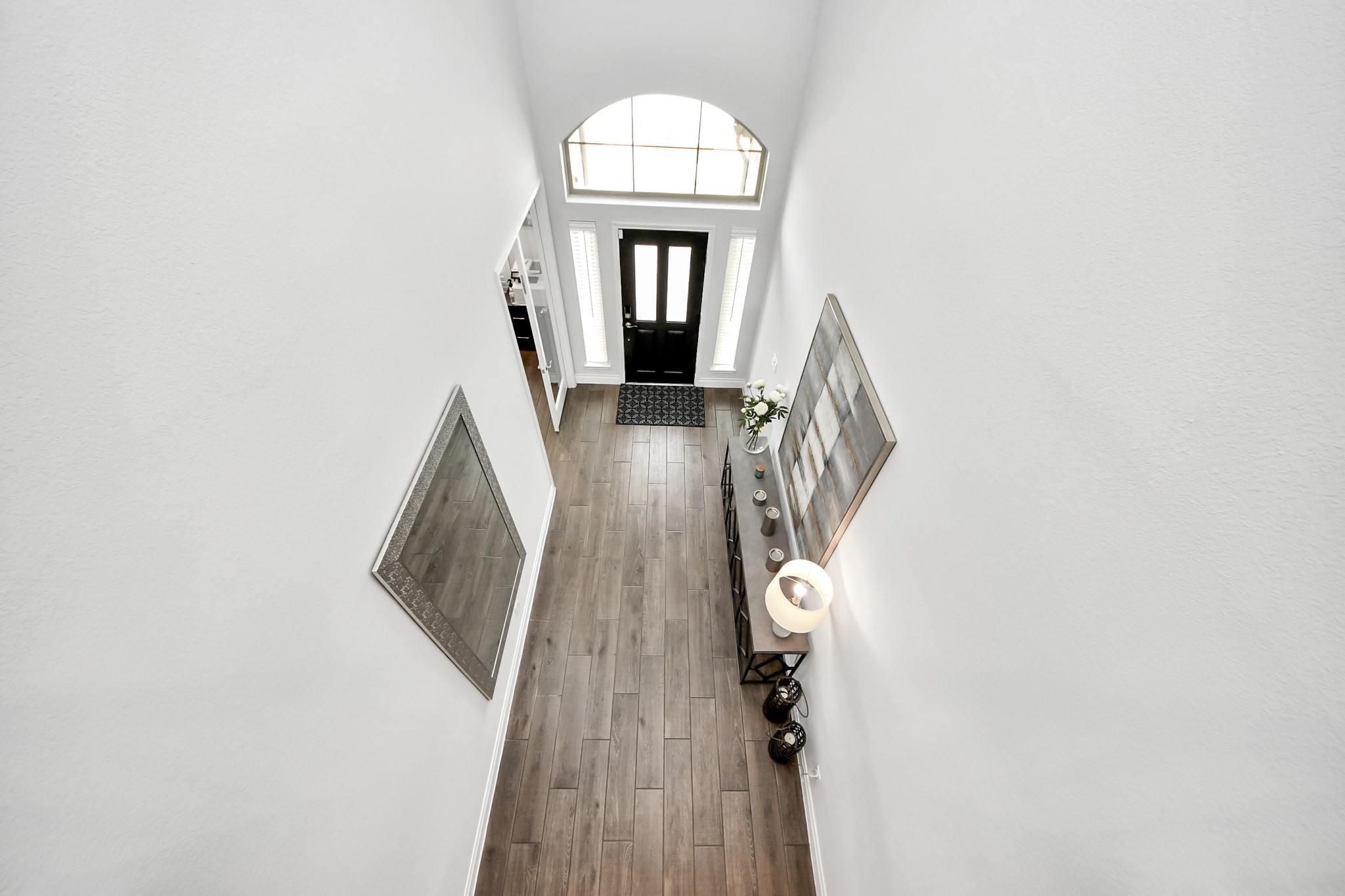2242 Bayleaf Manor Drive Manvel, TX 77578 - Photo 42 of 50 a view of a hallway with wooden floor and entryway
