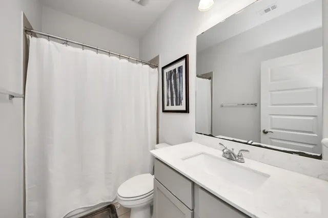 a bedroom with a bed and a television