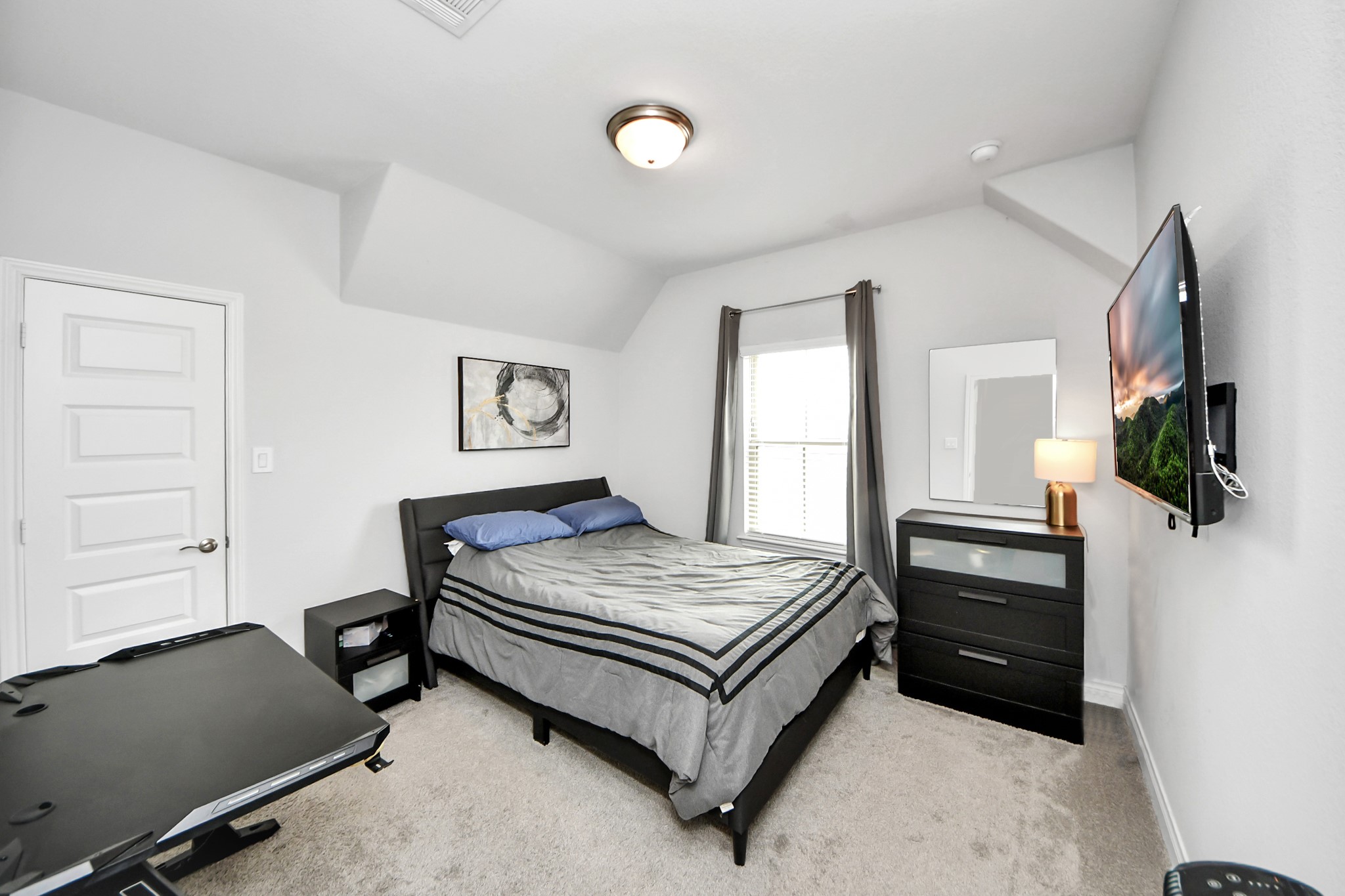 2242 Bayleaf Manor Drive Manvel, TX 77578 - Photo 44 of 48 a bedroom with a bed and a television