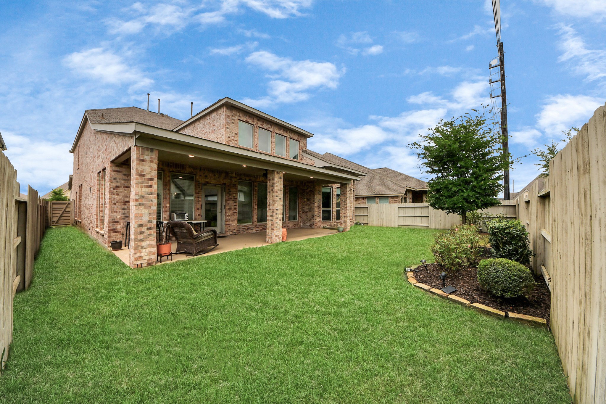 2242 Bayleaf Manor Drive Manvel, TX 77578 - Photo 48 of 48 a view of a house with backyard porch and garden