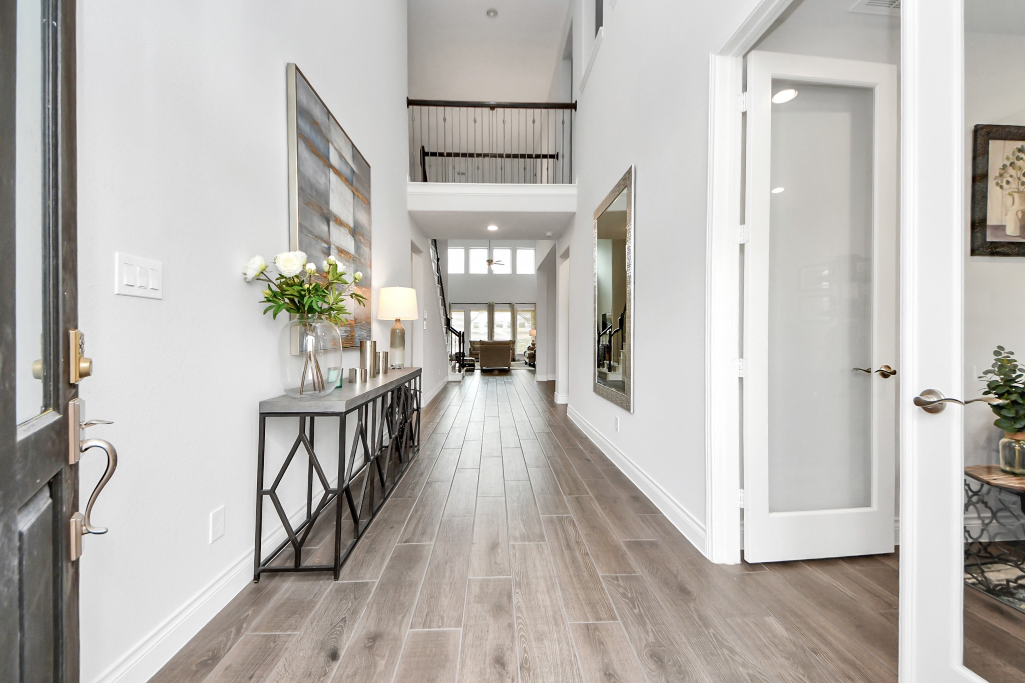 2242 Bayleaf Manor Drive Manvel, TX 77578 - Photo 8 of 50 a view of a hallway and wooden floor
