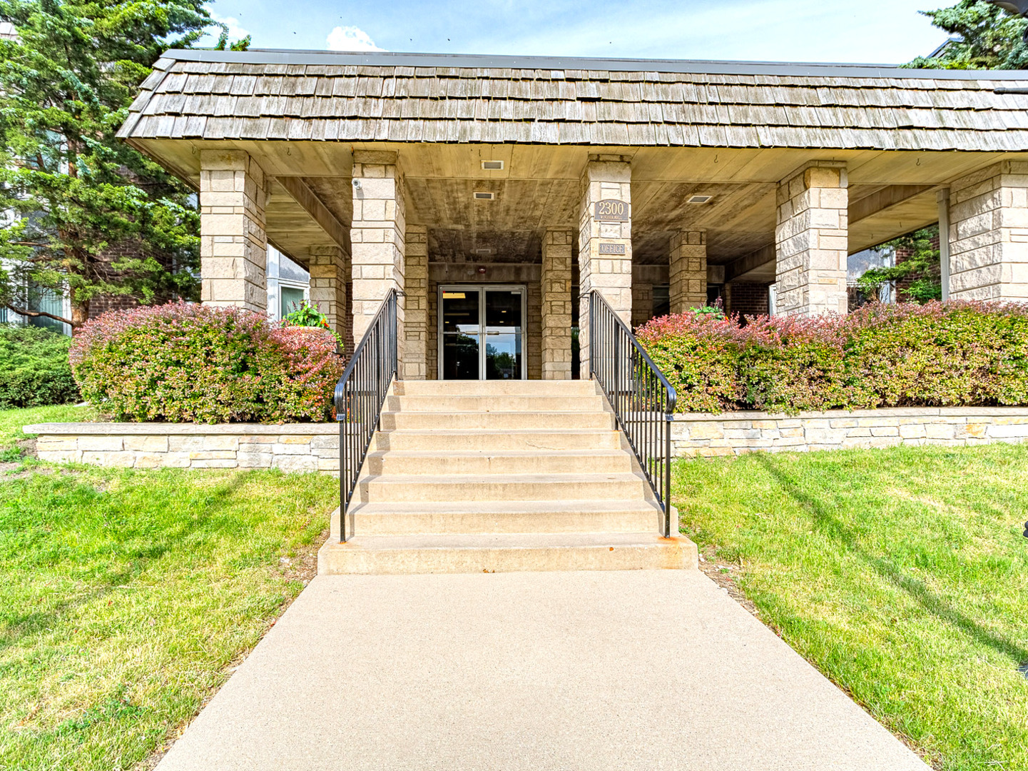 a view of a building with a garden