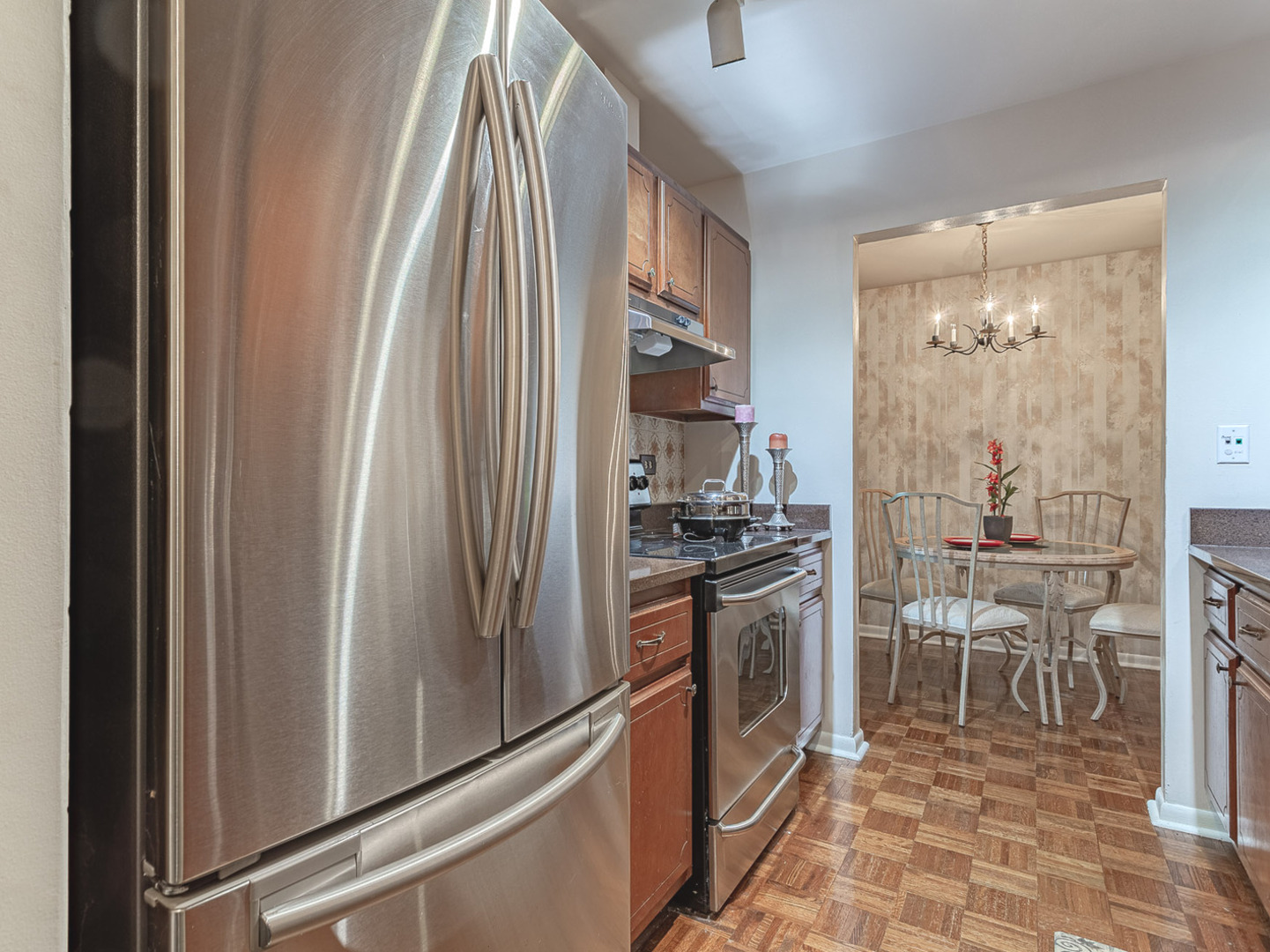 2300 Windsor Mall, Unit 2G Park Ridge, IL 60068 - Photo 4 of 15 a kitchen with stainless steel appliances granite countertop a refrigerator and a sink