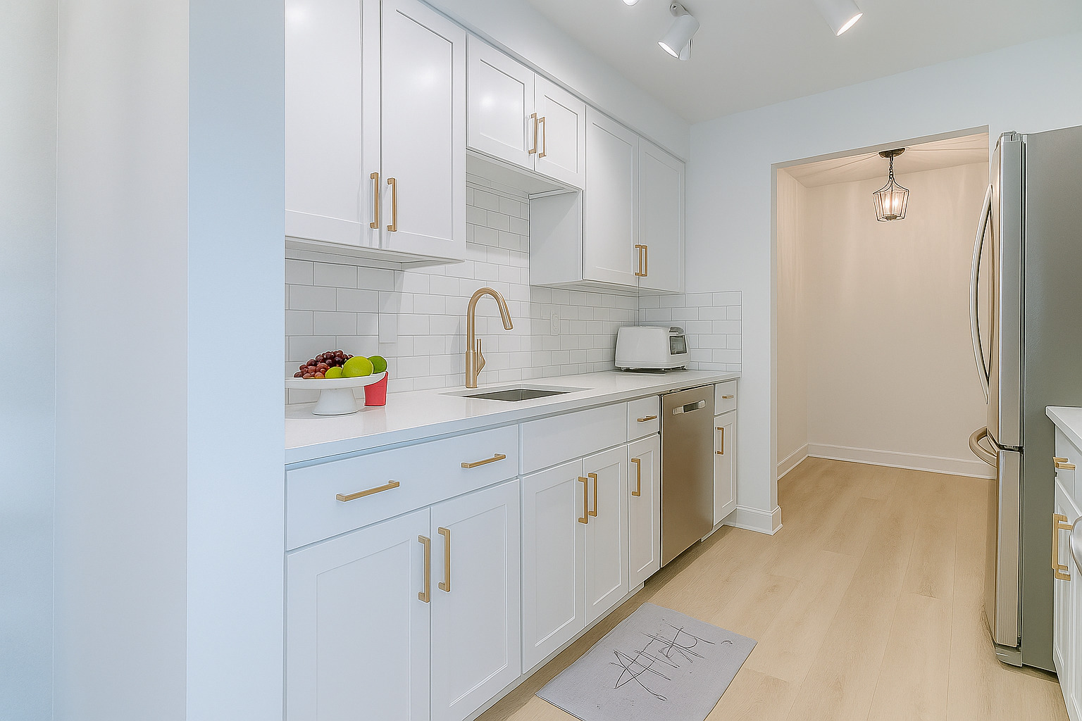 2300 Windsor Mall, Unit 2G Park Ridge, IL 60068 - Photo 6 of 15 a kitchen with stainless steel appliances white cabinets and a refrigerator